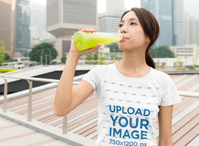 Heather T-Shirt Mockup of a Woman Drinking Juice in the City 46711-r-el2