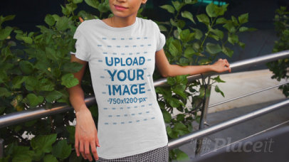 T-Shirt Video Featuring a Happy Woman Posing by an Urban Railing 3382v