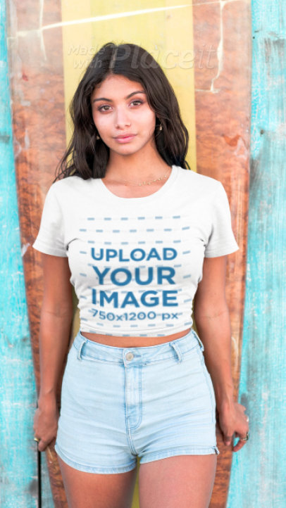 T-Shirt Video of a  Woman Standing Against a Surfboard 3305v