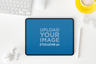 Digital Mockup Featuring an iPad on an a White Office Desktop M21398-r-el2