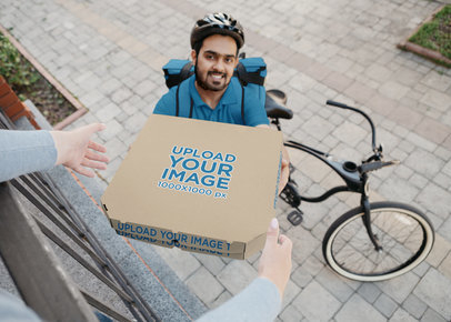 Mockup of a Smiling Man Delivering a Pizza Box m29112 r-el2