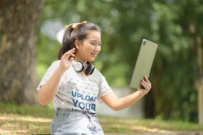 V-Neck T-Shirt Mockup of a Smiling Woman Doing a Video Call on Her Tablet m19681 r-el2