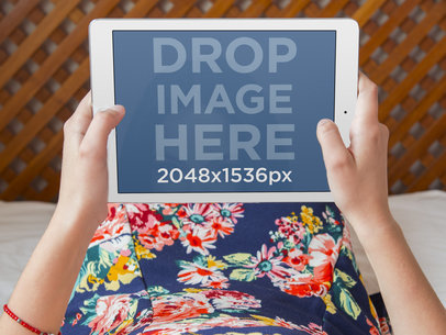 iPad Mockup Template Featuring a Young Woman Laying in Bed