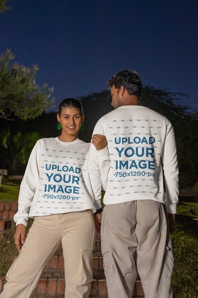 Mockup of a Happy Man and Woman Wearing Matching Crewneck Sweatshirts