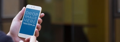 iPhone Mockup of a Businesswoman Outside the Office