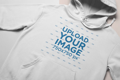 Closeup Mockup of a Hoodie Facing Upwards on a Duo Colored Surface