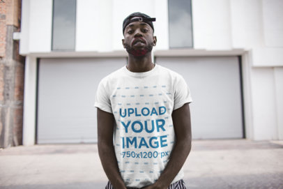 T-Shirt Mockup of a Man with an attitude in an Urban Scenario