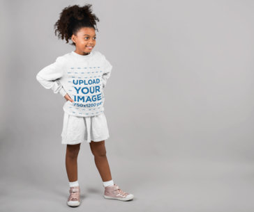 Heather Sweatshirt Mockup of a Little Girl Standing in a Studio