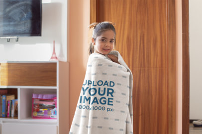 Mockup of a Little Girl Wrapped in a Throw Blanket