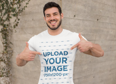 Mockup of a Muscular Man Pointing at His T-Shirt