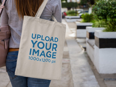 Canvas Tote Bag Mockup Over a Woman's Shoulder