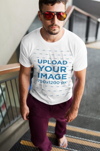 T-Shirt Mockup Featuring a Man Going Upstairs