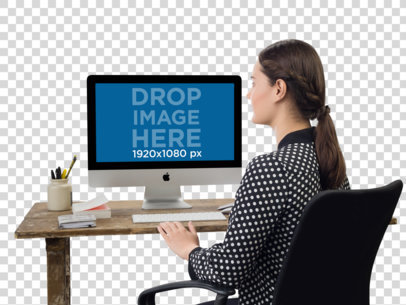 iMac Mockup of a Woman Typing on Her Desktop Computer