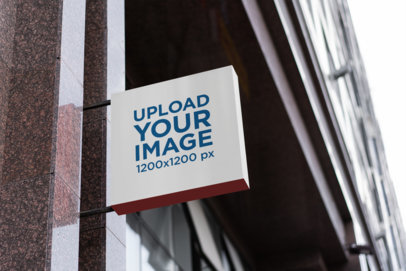 Mockup of a Sign Attached to a Tall Building 2214-el1