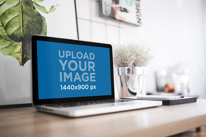 Mockup of a MacBook Pro Placed on a Modern Working Desk 2442-el1