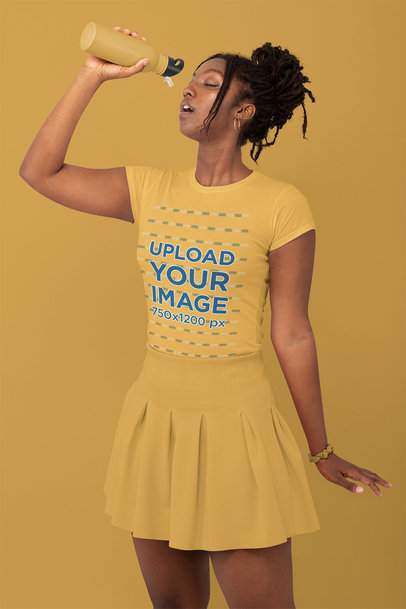 Monochromatic T-Shirt Mockup of a Stylish Woman Drinking Water at a Studio 32794