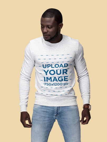 Mockup Featuring a Man Wearing a Customizable Sweatshirt at a Studio