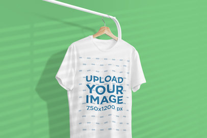Mockup of a One Tee Hanging From a Clothing Rack Featuring a Background Shadow 3734-el1
