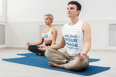 Sleeveless Shirt Mockup of a Man and Woman with Sports Bra Meditating at a Minimalist Studio 