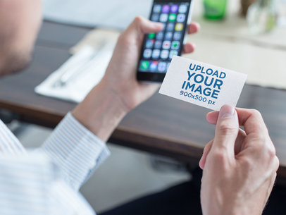 Mockup of a Business Man Using a Business Card to Contact a Person with his Phone a15032
