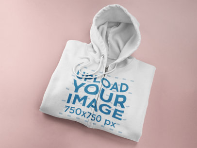 Mockup of a Folded Full Zip Hoodie Lying on a Flat Surface