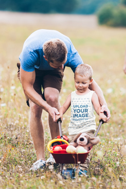 Tank Top Mockup of a Little Boy Playing Outdoors with His Dad M3120-r-el2