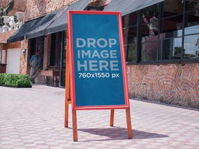 Placeit - Long Horizontal Sign Mockup Outside a Front Window of a Store